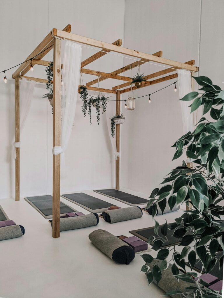 Peaceful yoga studio in Sydney with mats and wooden decor.